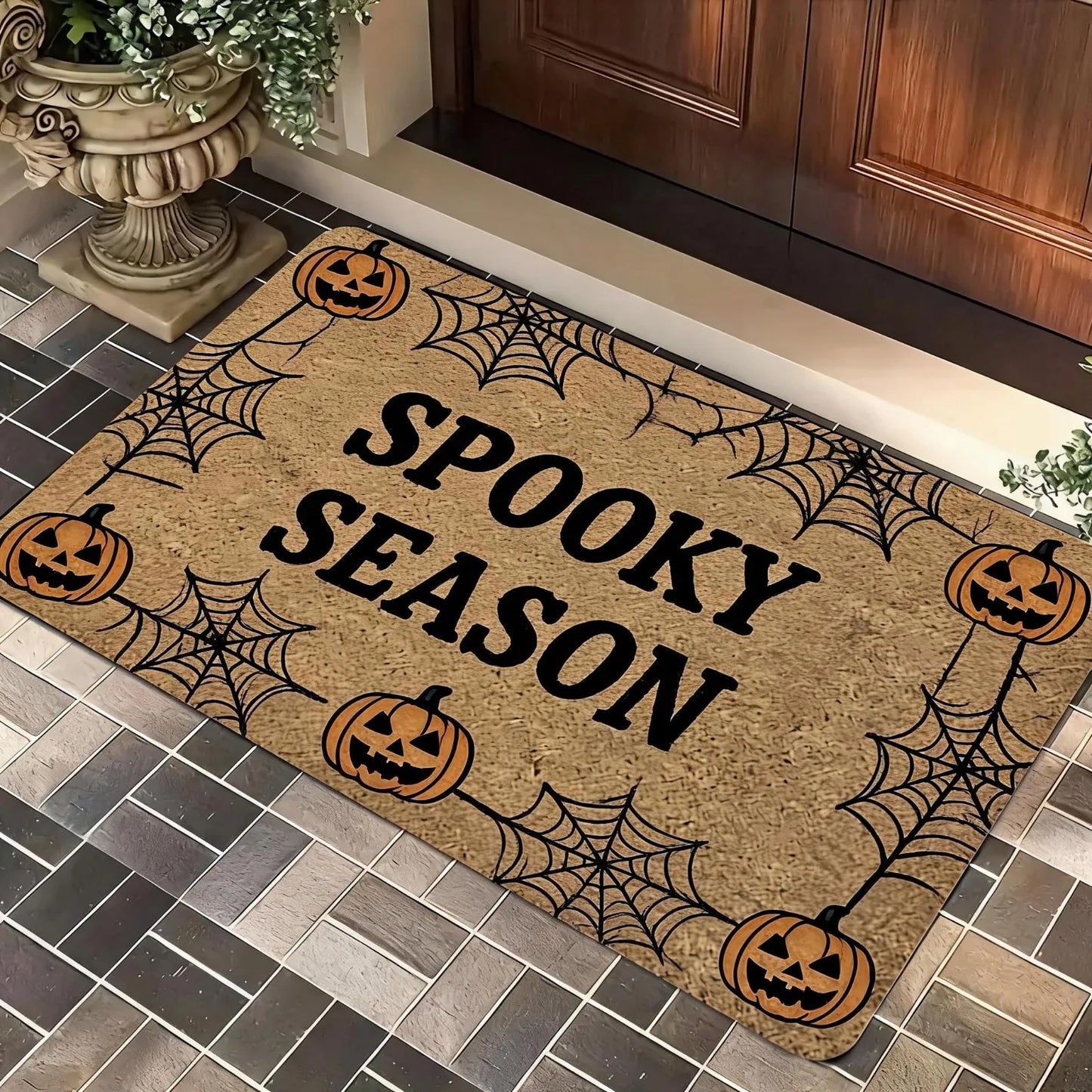 A Magical Doormat Featuring 'THE WITCH IS IN', Made of Plush Material with a Thickness of 0.4 Inches And Weighing 1.28 LB. It Has a Brown Base with a Black Star And Spell Design, for Halloween